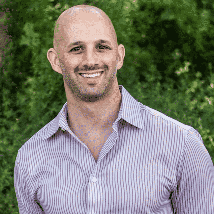 Man in button down shirt smiling