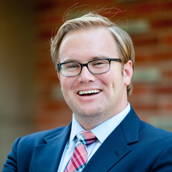 Picture of man in suit smiling