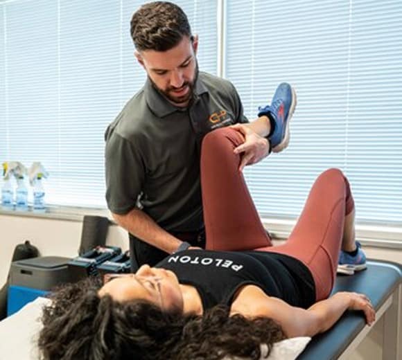 Sebastian providing hip physical therapy