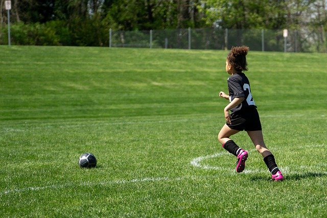 Child playing soccer