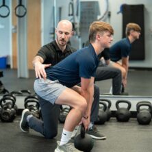 Zac coaching Jack on a deadlift